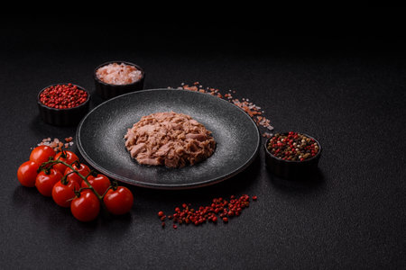 Tuna, canned fish in a can and on a plate for making sandwiches and other food. Canned tuna as an ingredient for cooking healthy foodの写真素材