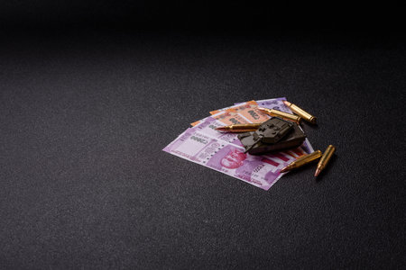 Money and flag of India with ammunition and tank as a concept of weapons and preparation for war....