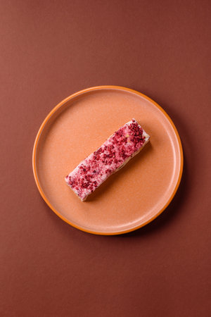 Nougat or white caramel with hazelnuts and pistachios and strawberry pieces. White nougat with nuts, sweets for the festive tableの写真素材