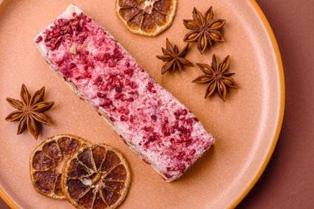 Nougat or white caramel with hazelnuts and pistachios and strawberry pieces. White nougat with nuts,...