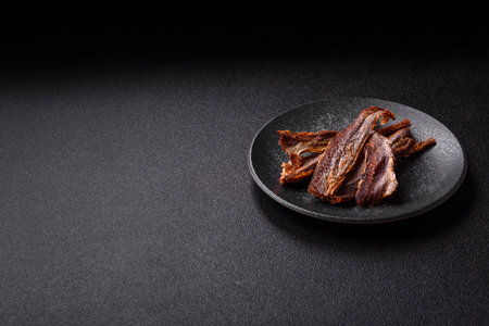 Dried salted fish as snacks or jerky, seafood as slices. Dried seafood snacks as a background for your designの写真素材