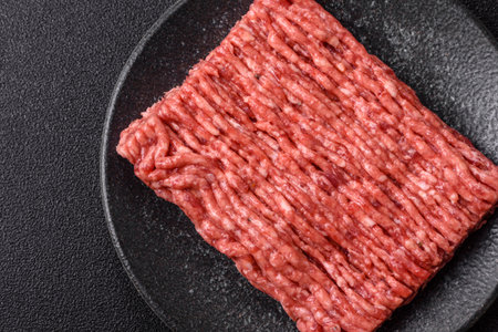 Raw ground beef meat food, ingredient for making cutlets or meatballs. Raw ground beef for your...