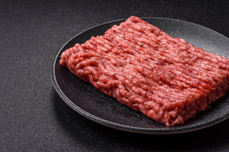 Raw ground beef meat food, ingredient for making cutlets or meatballs. Raw ground beef for your...