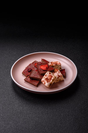 Bar sweet craft artisan chocolate with dried fruits made at home. Craft chocolate as a background for your designの写真素材