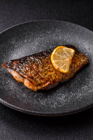 Food, seafood, grilled fish fillet with lemon, salt and spices. Grilled fish fillet for lunch,...