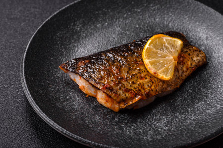Food, seafood, grilled fish fillet with lemon, salt and spices. Grilled fish fillet for lunch, healthy foodの写真素材
