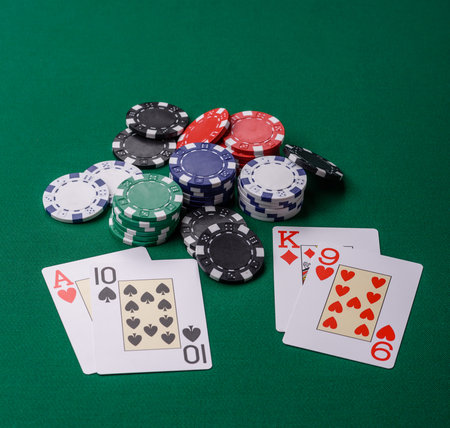 Playing blackjack or baccarat card game in casino with chips, bets and risk. Cards and chips on...