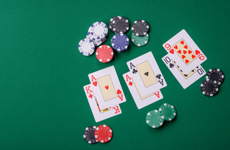 Playing blackjack or baccarat card game in casino with chips, bets and risk. Cards and chips on...