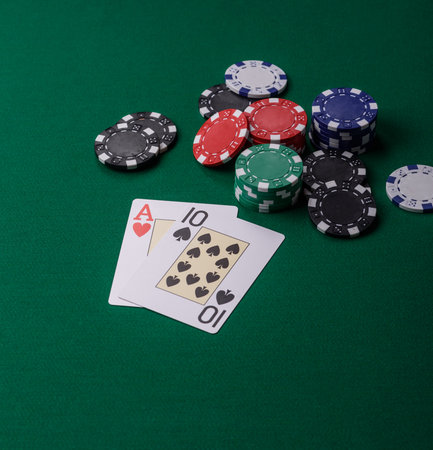 Playing blackjack or baccarat card game in casino with chips, bets and risk. Cards and chips on...