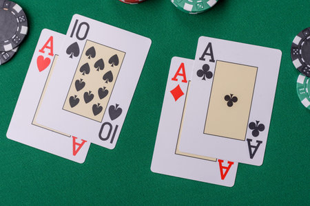 Playing blackjack or baccarat card game in casino with chips, bets and risk. Cards and chips on...
