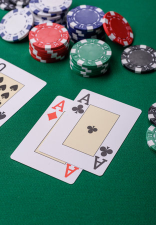 Playing blackjack or baccarat card game in casino with chips, bets and risk. Cards and chips on...