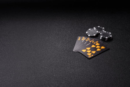 Playing card game poker with chips, bets and risk. Cards and chips on green felt as background for...