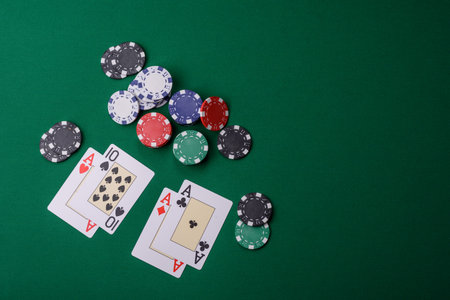 Playing blackjack or baccarat card game in casino with chips, bets and risk. Cards and chips on...
