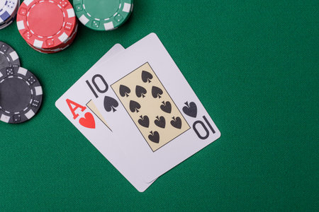 Playing blackjack or baccarat card game in casino with chips, bets and risk. Cards and chips on...