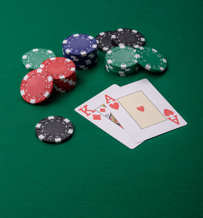 Playing blackjack or baccarat card game in casino with chips, bets and risk. Cards and chips on...