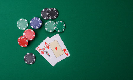 Playing blackjack or baccarat card game in casino with chips, bets and risk. Cards and chips on...