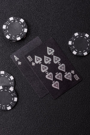 Playing blackjack or baccarat card game in casino with chips, bets and risk. Cards and chips on...