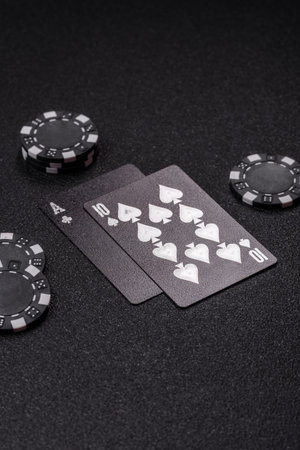 Playing blackjack or baccarat card game in casino with chips, bets and risk. Cards and chips on...