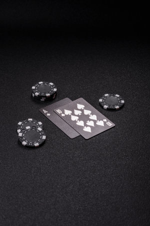 Playing blackjack or baccarat card game in casino with chips, bets and risk. Cards and chips on...