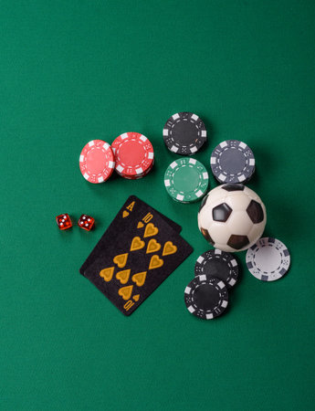 Playing blackjack or baccarat card game in casino with chips, bets and risk. Cards and chips on green felt as background for your designの写真素材