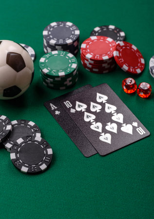 Playing blackjack or baccarat card game in casino with chips, bets and risk. Cards and chips on green felt as background for your designの写真素材