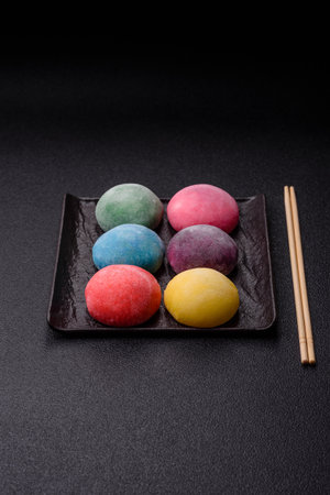 Japanese mochi, ice cream or Asian sweets made from rice flour with fruit filling. Mochi of...