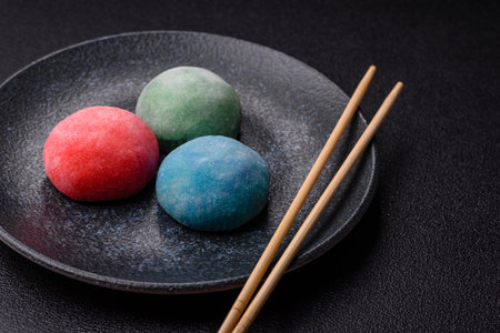 Japanese mochi, Asian sweets made from rice flour with fruit filling. Mochi of different colors with...
