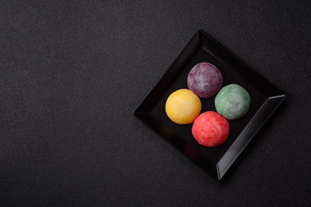 Japanese mochi, ice cream or Asian sweets made from rice flour with fruit filling. Mochi of...