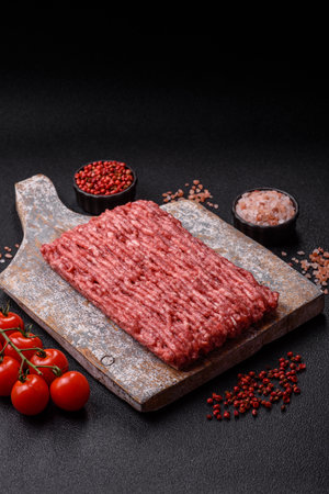 Raw minced beef or pork, ground meat for burgers. Raw minced red as food background