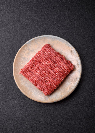 Raw minced beef or pork, ground meat for burgers. Raw minced red as food background