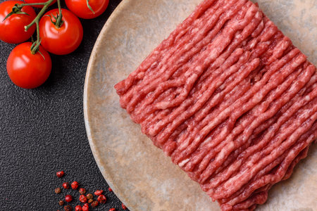 Raw minced beef or pork, ground meat for burgers. Raw minced red as food background