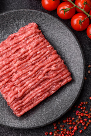 Raw minced beef or pork, ground meat for burgers. Raw minced red as food background