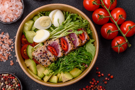 Seafood bowl, tuna tataki fillet slices with rice, oranges, tomatoes and sauce. Tuna bowl as a food background for your designの写真素材