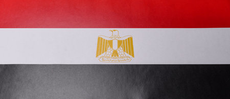 Egyptian flag in red, white and black colors as a symbol of independence. Flag of Egypt as a background for your designの写真素材