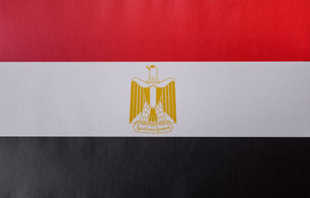 Egyptian flag in red, white and black colors as a symbol of independence. Flag of Egypt as a background for your designの写真素材