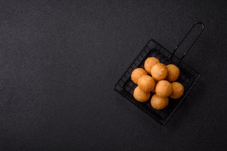 Cheese balls, croquettes or arancini with potatoes or rice. Cheese balls, takeaway, fast food