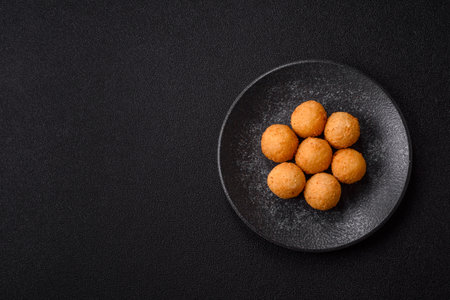 Cheese balls, croquettes or arancini with potatoes or rice.
