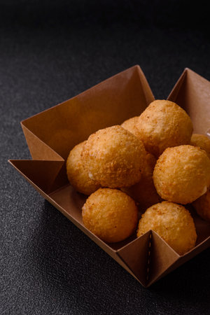 Cheese balls, croquettes or arancini with potatoes or rice.