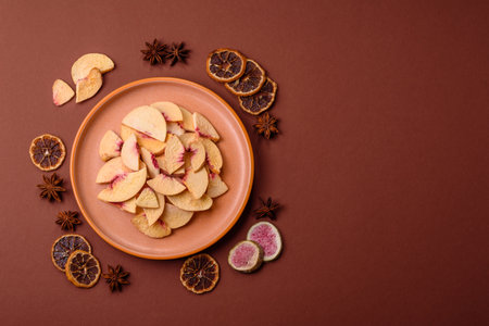 Dried sublimated slices of peach or apricot as an ingredient for sweet desserts. Dried peach as a...