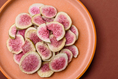 Dried sublimated fig slices as an ingredient for sweet desserts. Dried figs as a food background for...