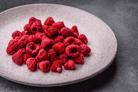 Dried sublimated slices of raspberry as an ingredient for sweet desserts. Dried raspberry as a...