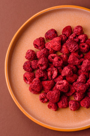Dried sublimated slices of raspberry as an ingredient for desserts. Dried raspberry as a food background for your designの写真素材