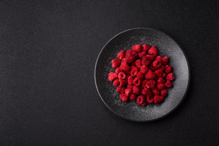 Dried sublimated slices of raspberry as an ingredient for sweet desserts. Dried raspberry as a food background for your designの写真素材