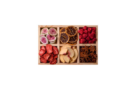 Box of dried fruits strawberries, raspberries, figs and peaches as ingredients for desserts. Dried fruits as food backgroundの写真素材
