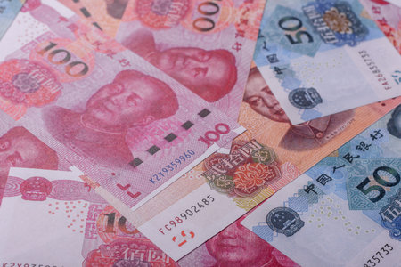 Cash, paper yuan banknotes for business transactions, financial background. Yuan banknotes as...