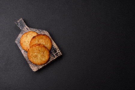 Fried potato and onion pancakes with spices for breakfast. Fried hash browns as a food backgroundの写真素材