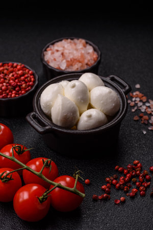 Mozzarella cheese balls, fresh white mini slices as an ingredient for Mediterranean food. Mozzarella cheese as a background for your designの写真素材