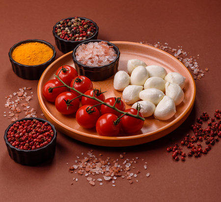 Mozzarella cheese balls, fresh white mini slices as an ingredient for Mediterranean food. Mozzarella cheese as a background for your designの写真素材