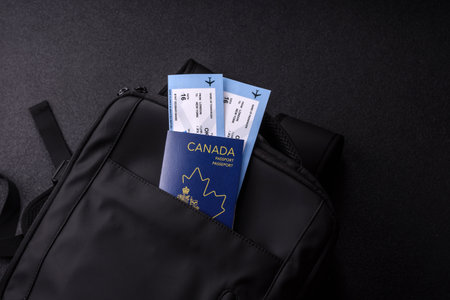Passport Canada, visa for travel, document with tickets in travel bag. Canadian passport as background for your designの写真素材