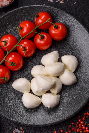 Mozzarella cheese balls, fresh white mini slices as an ingredient for Mediterranean food. Mozzarella cheese as a background for your designの写真素材